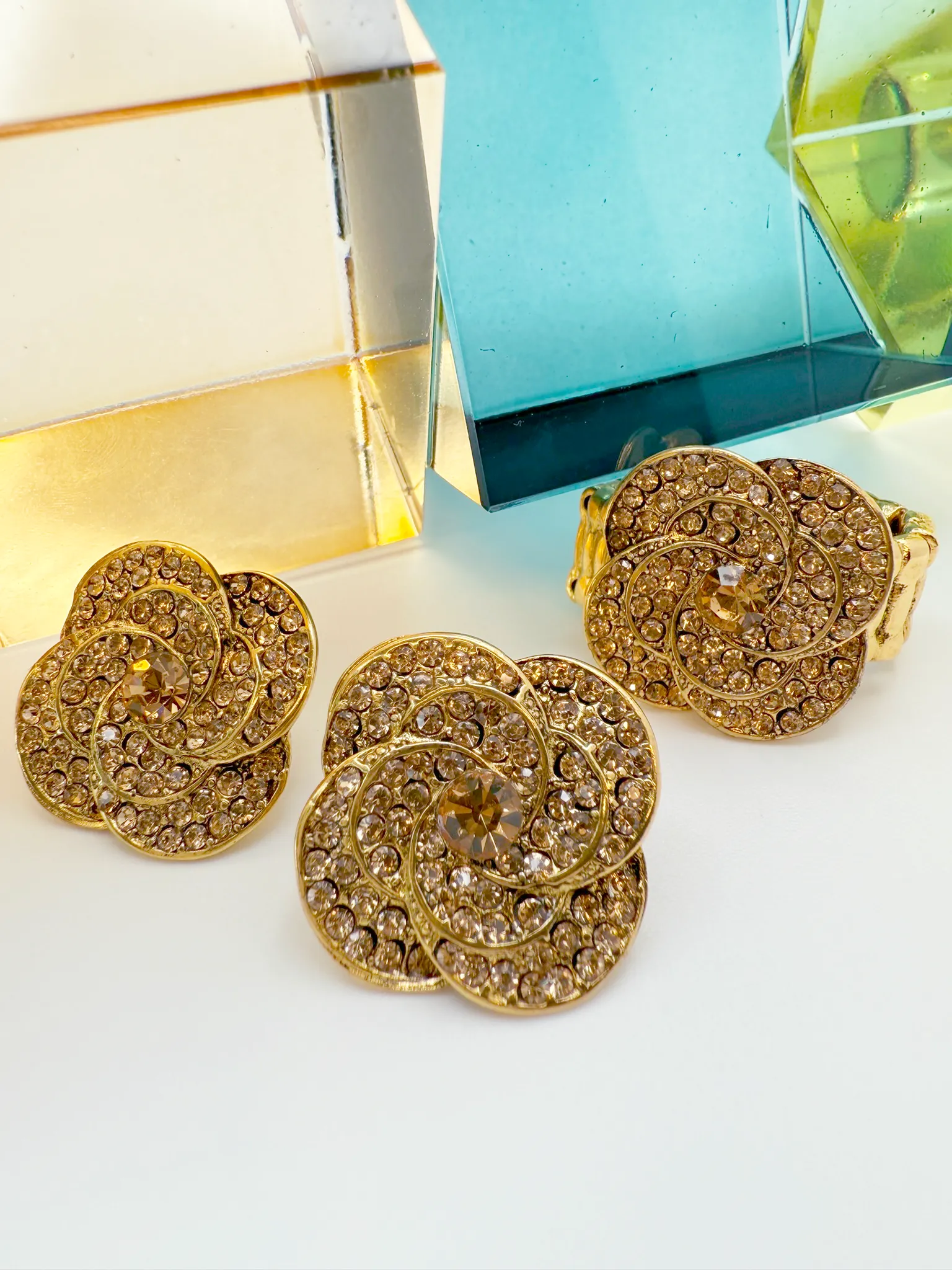 Dazzling Floral Swirl Stud Earrings – Gold & Crystal Design