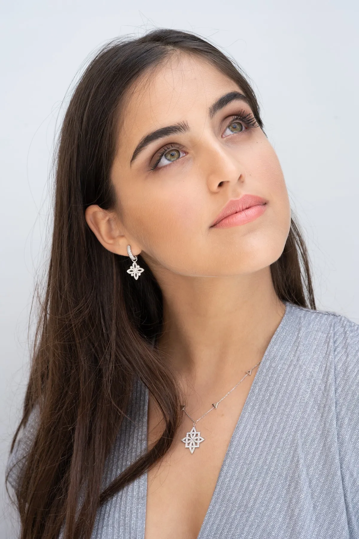 Iris diamond huggie earrings with
