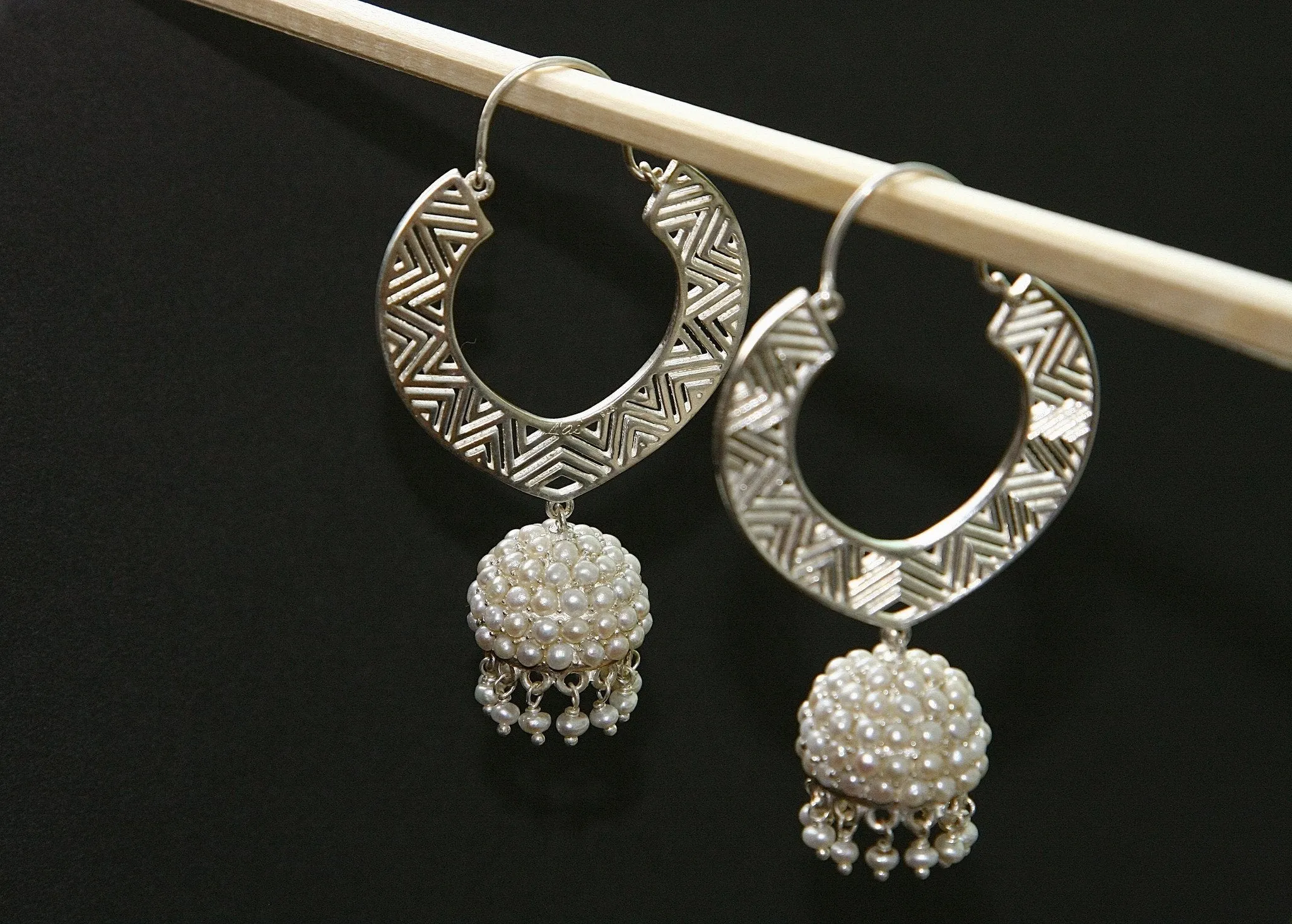 Large, chevron cut-out pattern chandelier earrings with 'jhumkis'