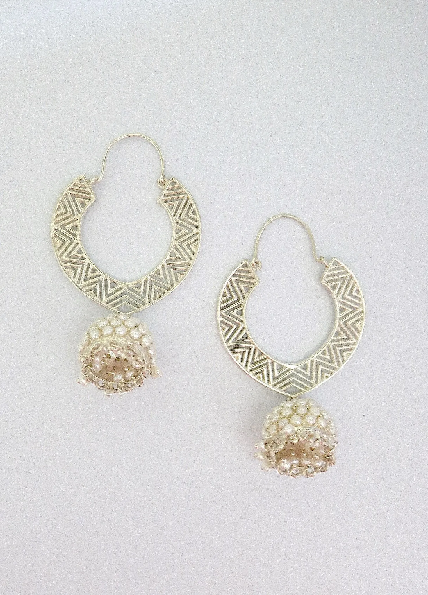 Large, chevron cut-out pattern chandelier earrings with 'jhumkis'