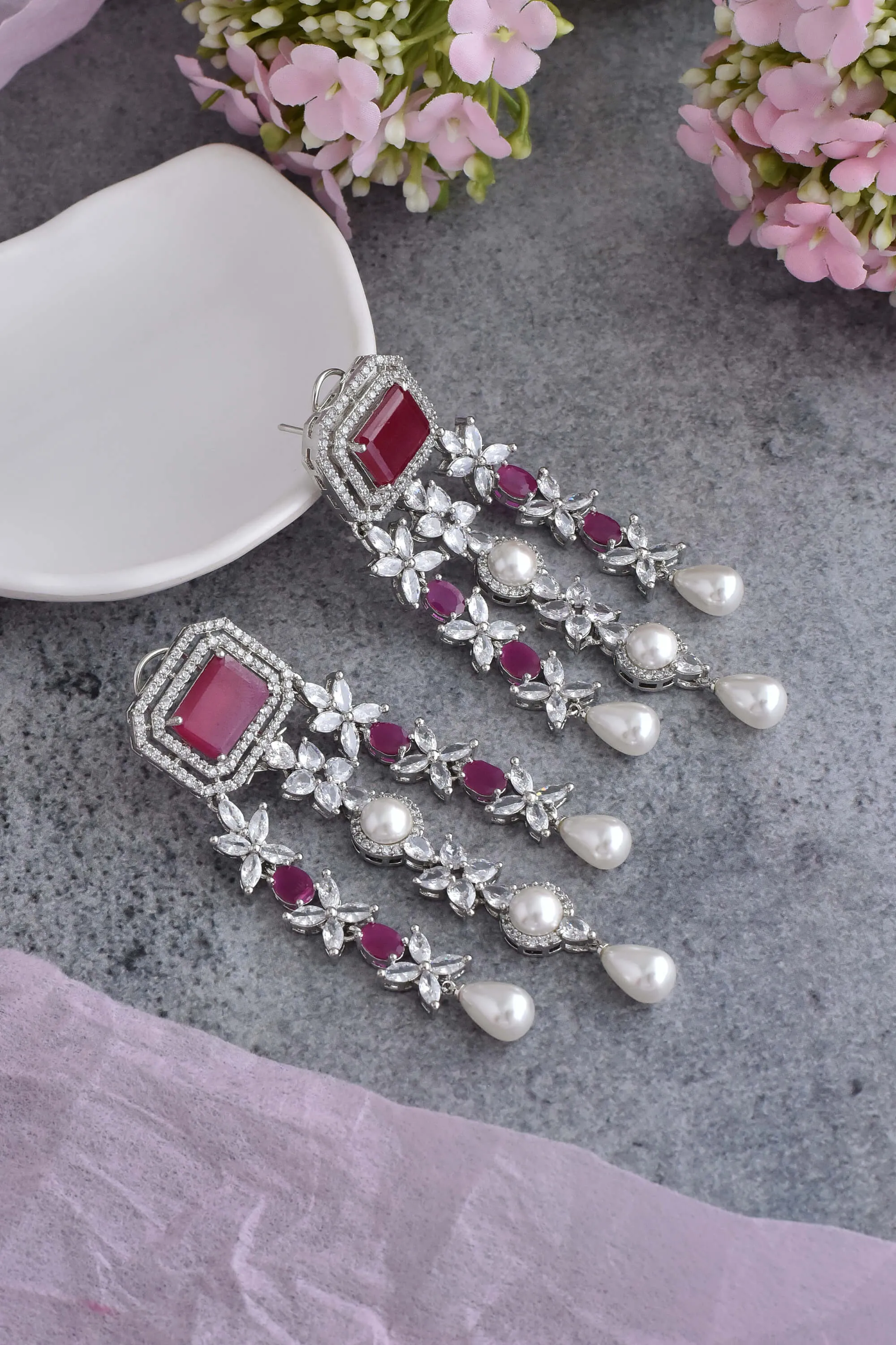 Red silver tone dangler earrings